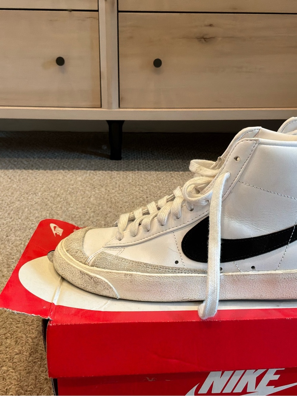 Nike White High-Top Sneakers with Black Swoosh